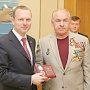 Константин Бахарев вручили награды ликвидаторам Чернобыльской катастрофы